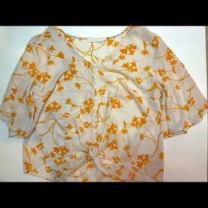 White and orange blouse.